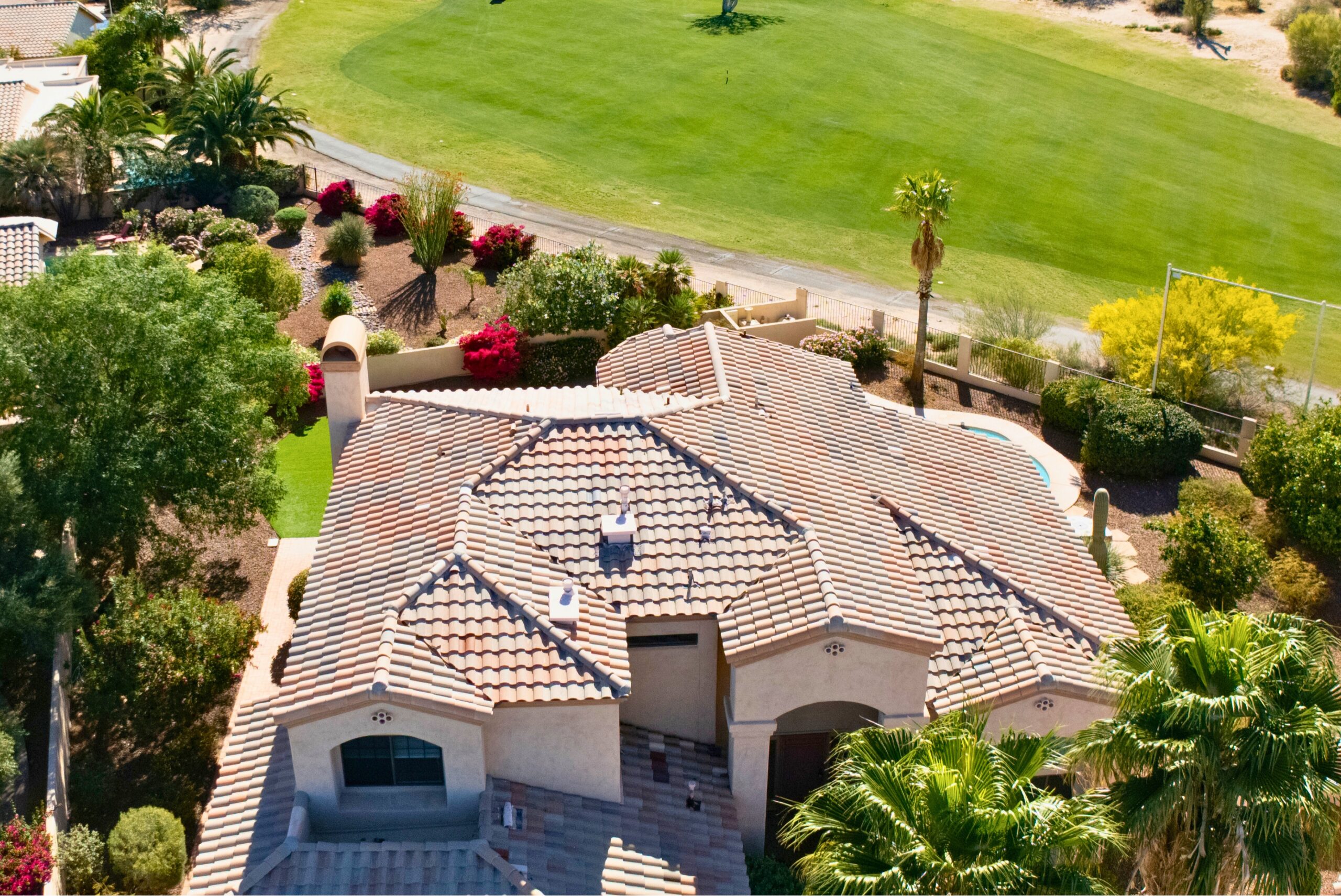 Aerial view of a Cañada Hills home beside a golf course in Oro Valley
