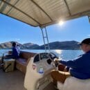 Captain Darren on the pontoon rental boat at Roosevelt Lake in Arizona