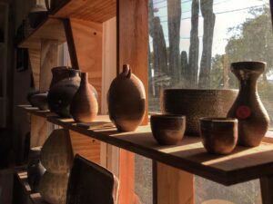 Pots on a shelf at the Tucson Clay Co-op