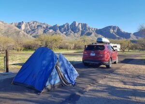 image of a blue tent and red car in front of Tucson Mountain Park