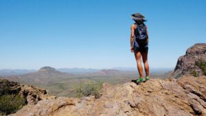 Image of a woman with her back to the camera overlooking Tucson Mountain Park