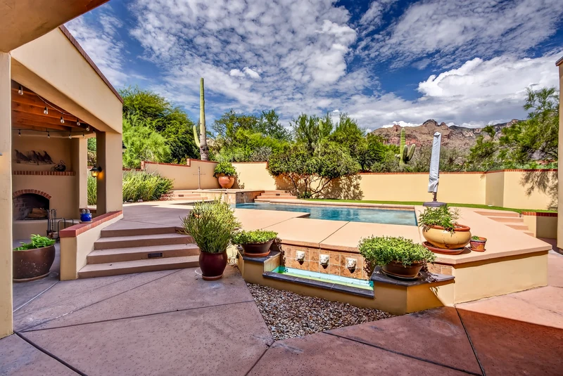Private Pool, fireplace, and  entertaining area Catalina Foothills luxury home